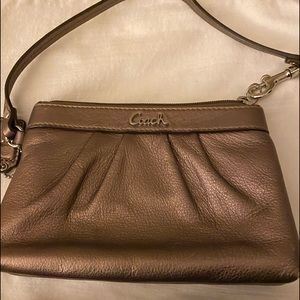 Bronze Coach clutch wristlet